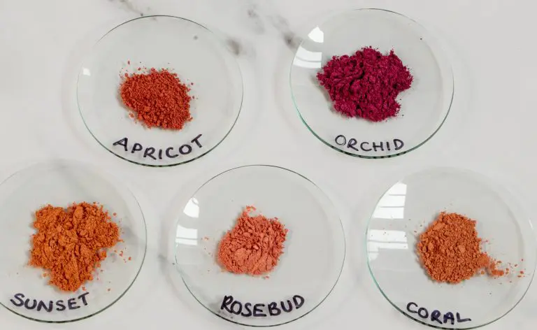 Five plates of colorful powdered pigments labeled.