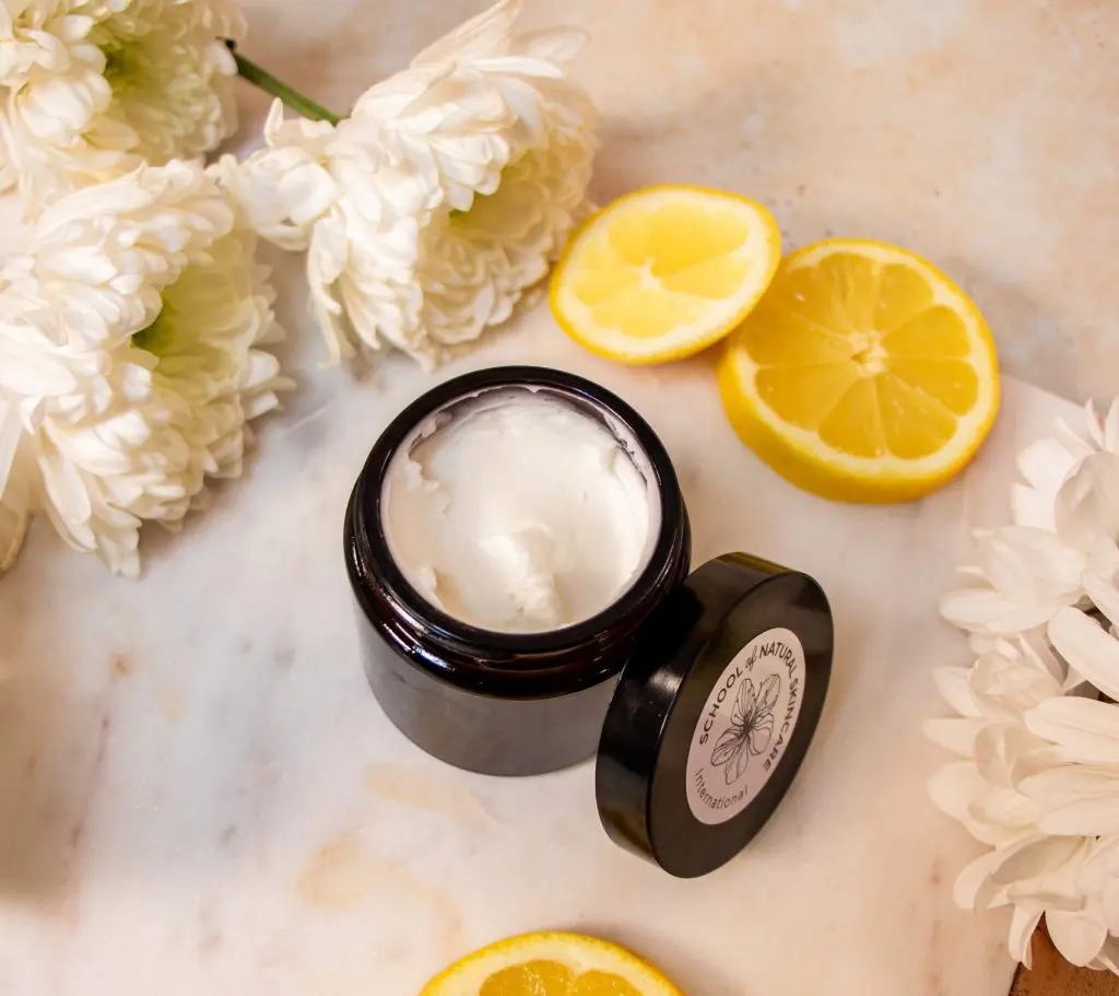 Natural cream with chrysanthemum flowers and lemon slices